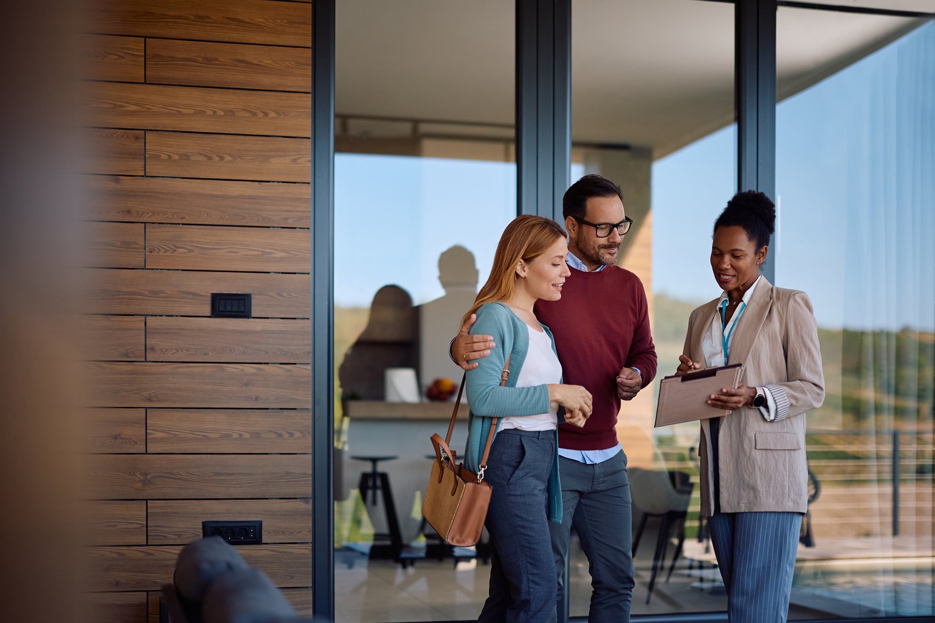 African American real estate agent helping clients find their dream home